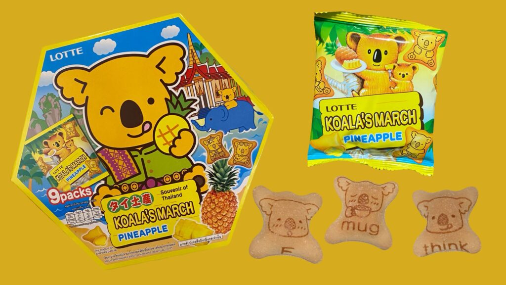 パイナップル味のコアラのマーチの箱パッケージ、右上は個包装のパッケージ、右下のクッキーは左からアルファベットでF、mug、thinkとプリントされているクッキーがある。