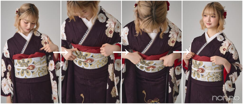 振袖の帯揚げがゆるんだ状態のバストアップ、帯揚げを指で帯に入れ込む動作
