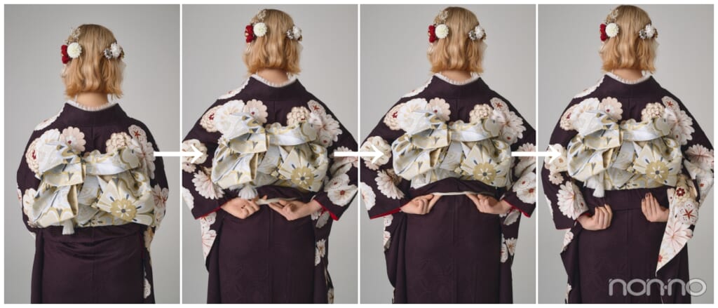 振袖の後ろ姿、帯の下がもたついている様子、腰紐に手を差し込み両サイドに流す動作