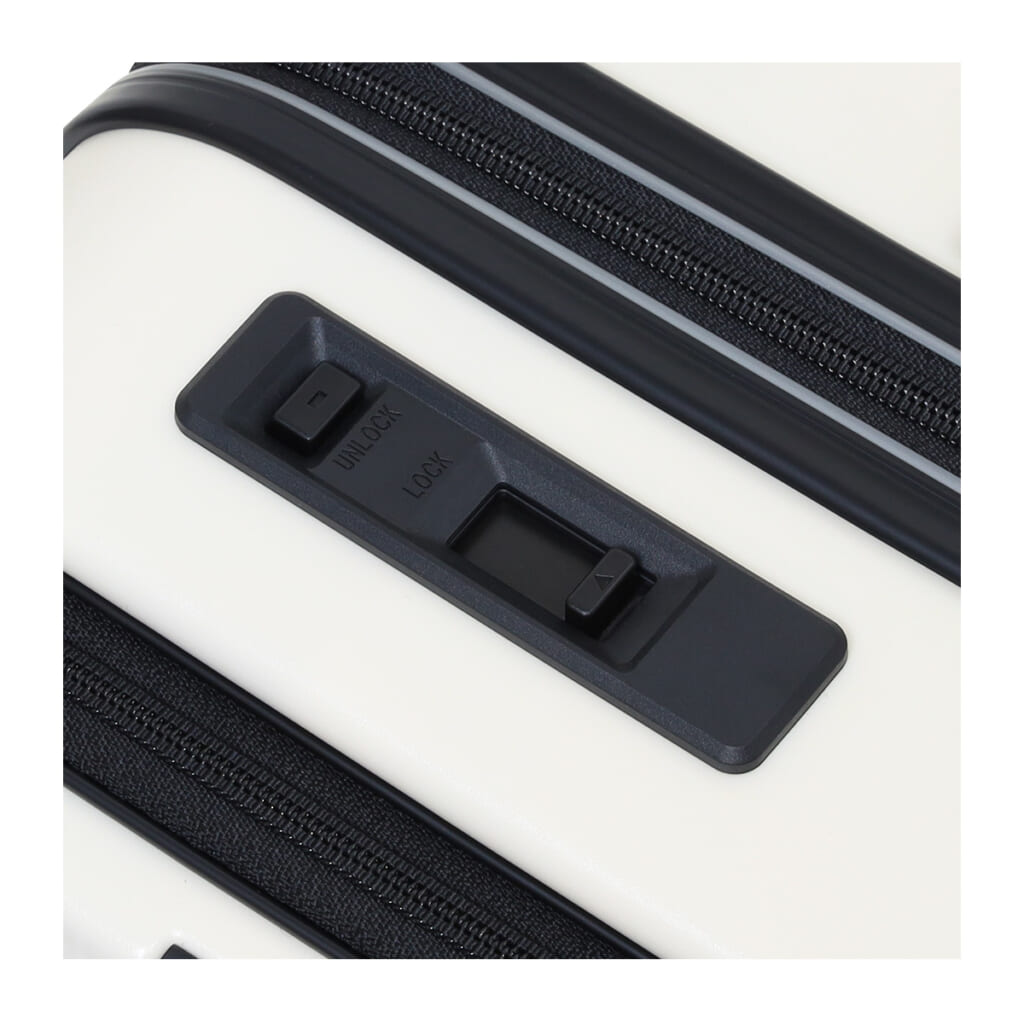 スーツケースのトップについたタイヤロックのボタン